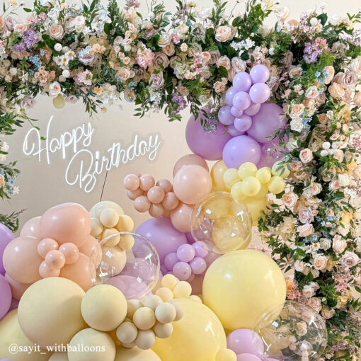 Pastel Balloons and Blush Roses Flower Arch for a Dreamy Celebration Backdrop
