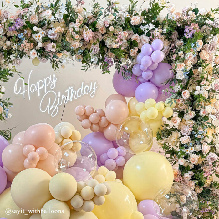Pastel Balloons and Blush Roses Flower Arch for a Dreamy Celebration Backdrop
