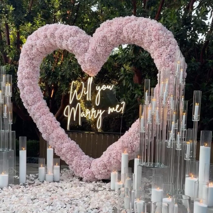 Create a Romantic Anniversary Moment with a Heart-Shaped Arch and Pink Roses