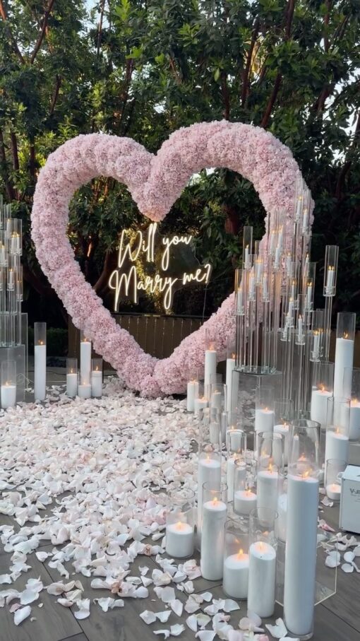 Create a Romantic Anniversary Moment with a Heart-Shaped Arch and Pink Roses