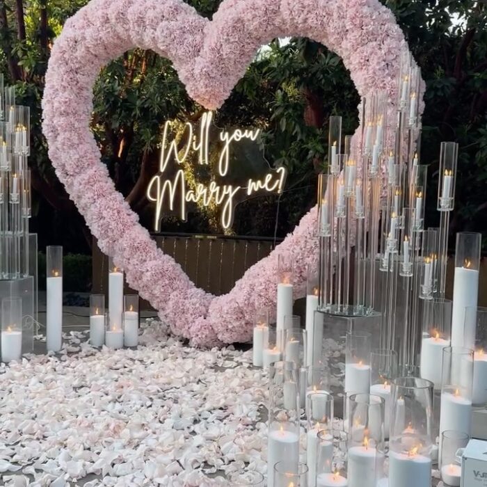 Create a Romantic Anniversary Moment with a Heart-Shaped Arch and Pink Roses