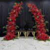 Stunning Wedding Arch with Red Roses and Green Leaves for a Timeless Look