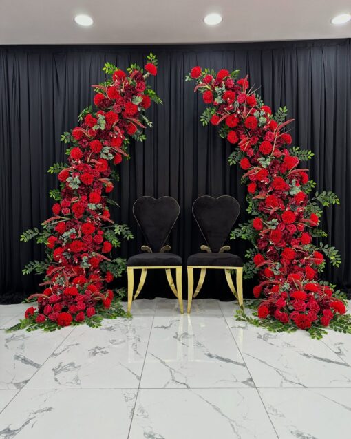 Stunning Wedding Arch with Red Roses and Green Leaves for a Timeless Look