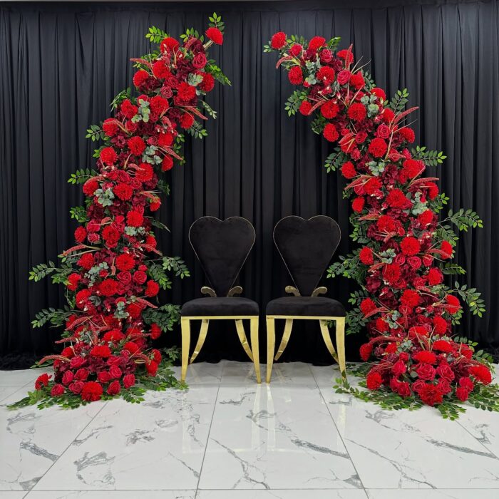 Stunning Wedding Arch with Red Roses and Green Leaves for a Timeless Look