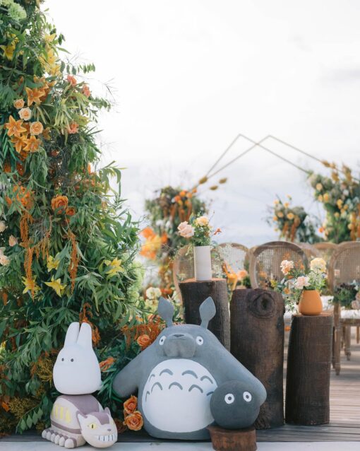 A Dreamy Ghibli-Themed Bali Wedding with Totoro Arch and Orange Floral Accents