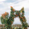 A Dreamy Ghibli-Themed Bali Wedding with Totoro Arch and Orange Floral Accents