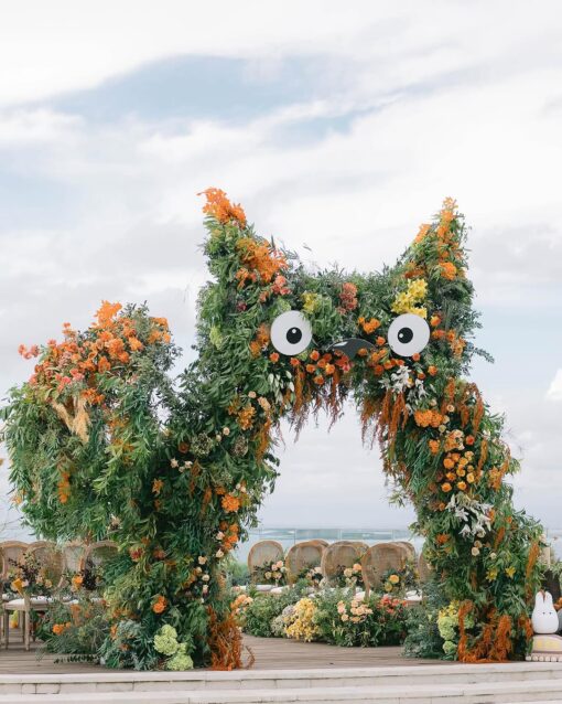 A Dreamy Ghibli-Themed Bali Wedding with Totoro Arch and Orange Floral Accents