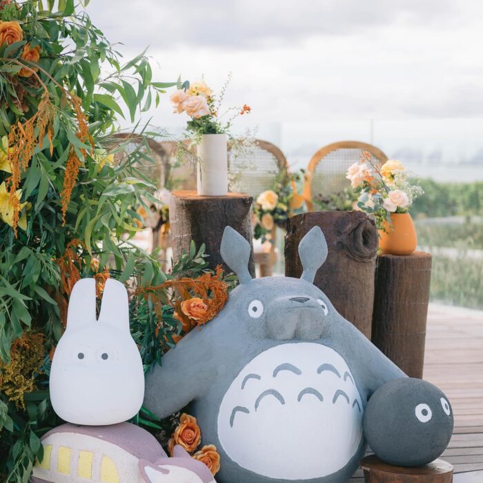 A Dreamy Ghibli-Themed Bali Wedding with Totoro Arch and Orange Floral Accents