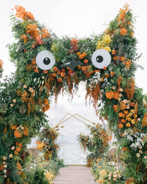 A Dreamy Ghibli-Themed Bali Wedding with Totoro Arch and Orange Floral Accents