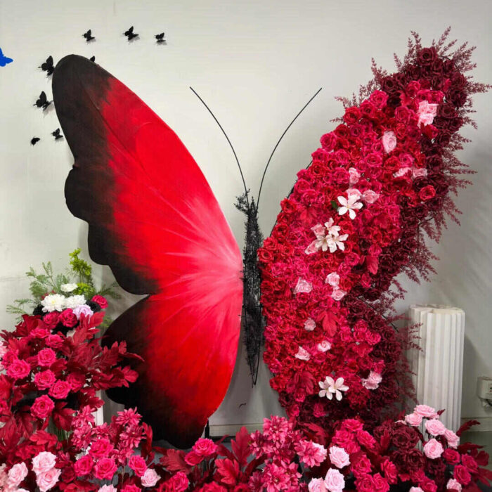 Artificial Rose-Accented Butterfly Backdrop with Gradient Red and Black Theme