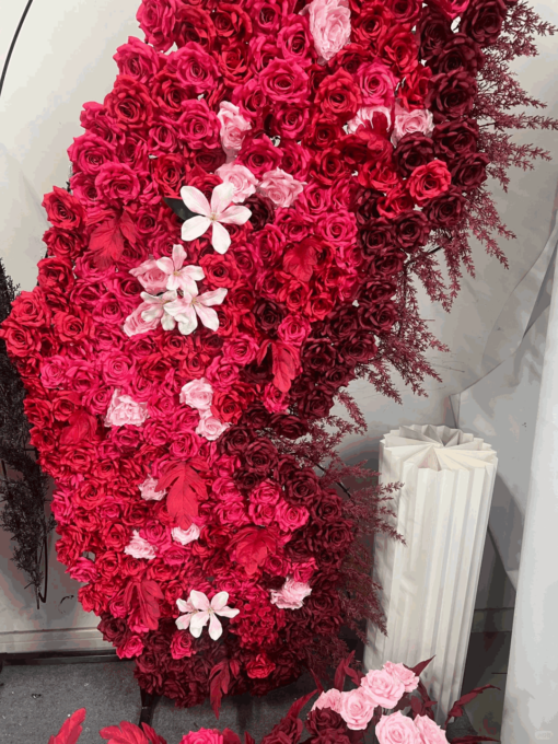 Artificial Rose-Accented Butterfly Backdrop with Gradient Red and Black Theme