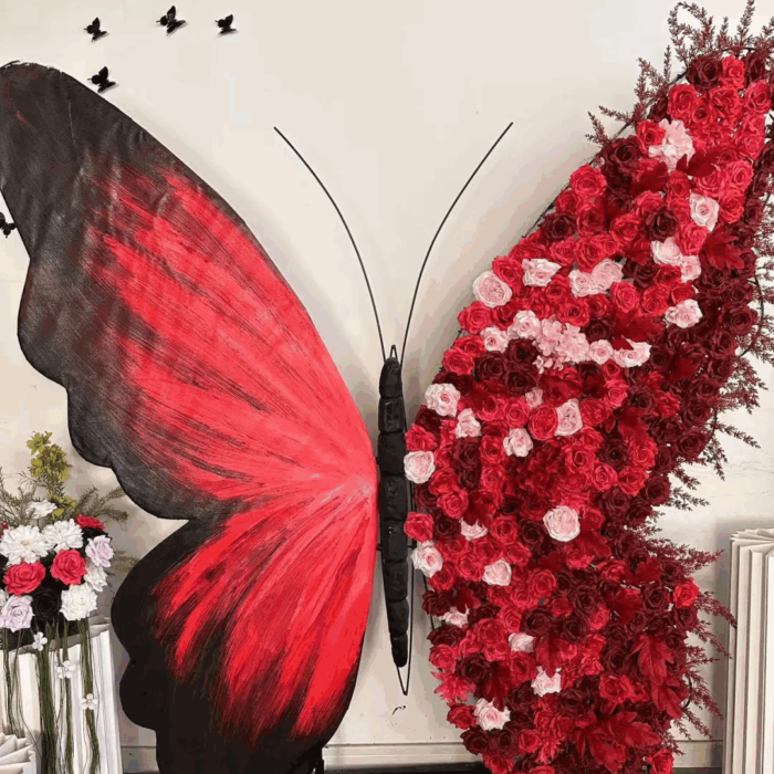 Artificial Rose-Accented Butterfly Backdrop with Gradient Red and Black Theme