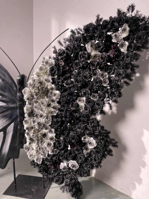 Artistic Black and White Butterfly Backdrop with Rose Arrangements for Luxury Displays