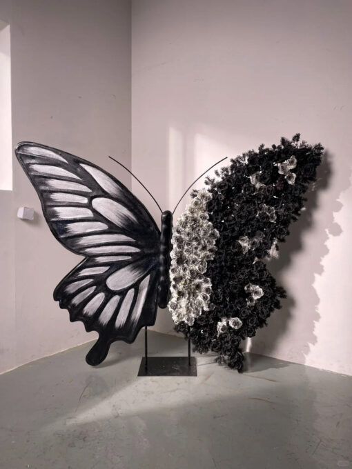 Artistic Black and White Butterfly Backdrop with Rose Arrangements for Luxury Displays