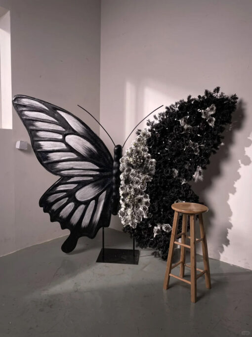 Artistic Black and White Butterfly Backdrop with Rose Arrangements for Luxury Displays