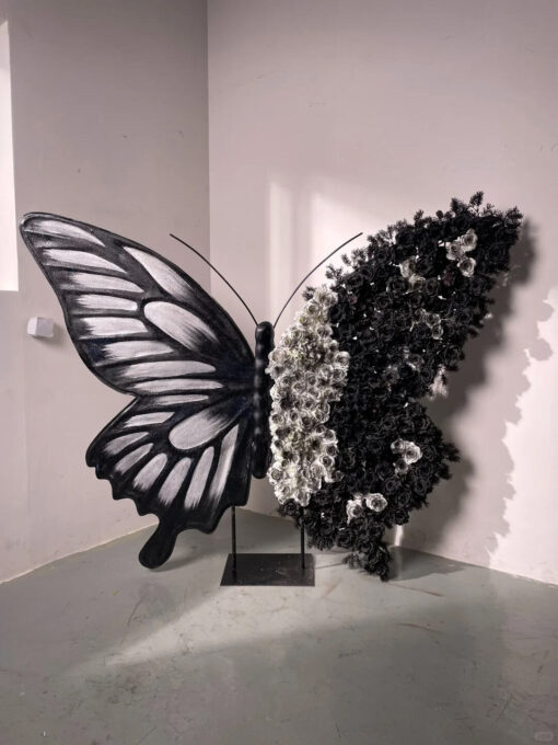Artistic Black and White Butterfly Backdrop with Rose Arrangements for Luxury Displays