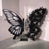 Artistic Black and White Butterfly Backdrop with Rose Arrangements for Luxury Displays