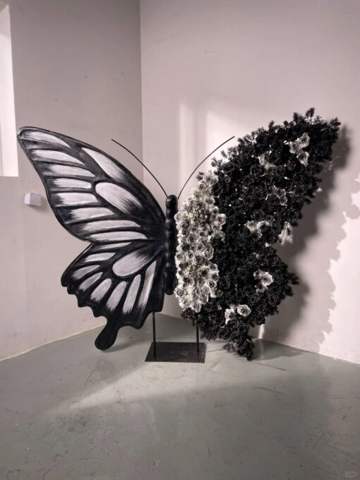 Artistic Black and White Butterfly Backdrop with Rose Arrangements for Luxury Displays