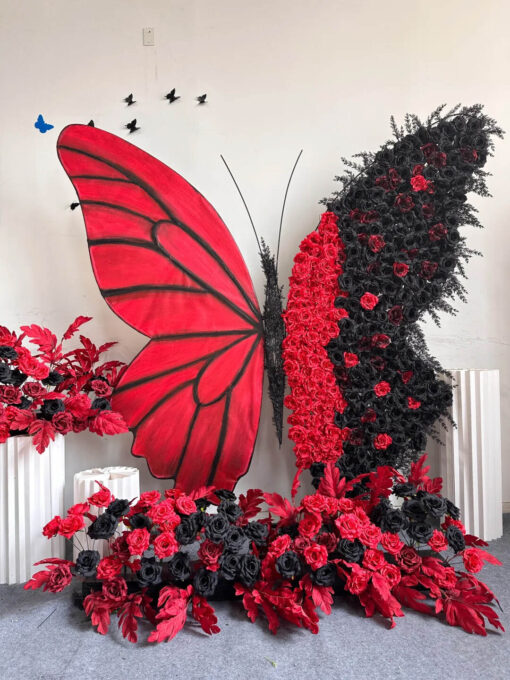 Artistic Red and Black Butterfly Backdrop with Lush Rose Arrangements