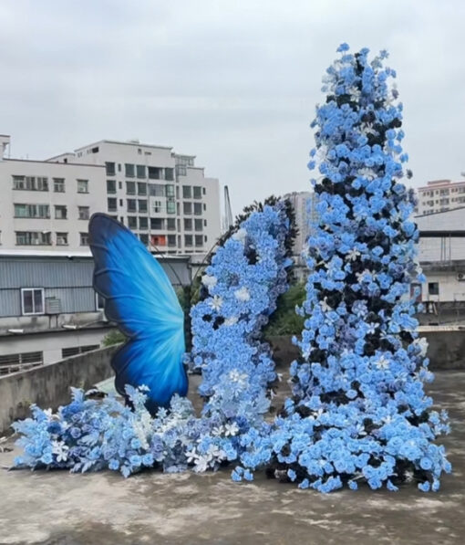 Beautiful Butterfly Backdrop with Blue Roses and White Floral Accents for Events
