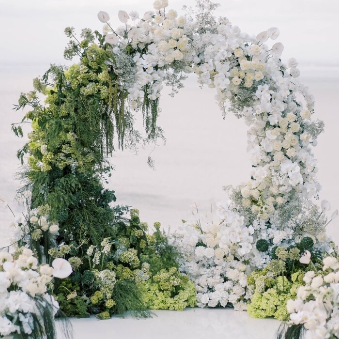 https://eventflowerwall.com/wp-content/uploads/2024/12/Beautiful-Greenery-and-White-Flower-Circle-Wedding-Arch-for-Romantic-Ceremonies-6.jpg