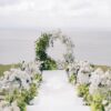 https://eventflowerwall.com/wp-content/uploads/2024/12/Beautiful-Greenery-and-White-Flower-Circle-Wedding-Arch-for-Romantic-Ceremonies-6.jpg