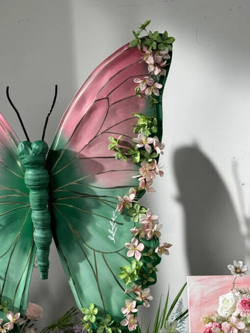 Blush Pink and Mint Green Butterfly Backdrop with Vibrant Spring Artificial Flower Display