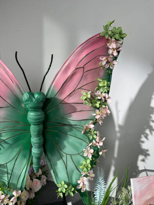 Blush Pink and Mint Green Butterfly Backdrop with Vibrant Spring Artificial Flower Display