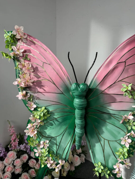 Blush Pink and Mint Green Butterfly Backdrop with Vibrant Spring Artificial Flower Display