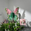 Blush Pink and Mint Green Butterfly Backdrop with Vibrant Spring Artificial Flower Display