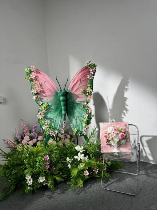 Blush Pink and Mint Green Butterfly Backdrop with Vibrant Spring Artificial Flower Display