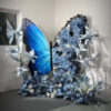 Chic Gradient Blue Butterfly Backdrop with Floral Accents for Gala Exhibitions