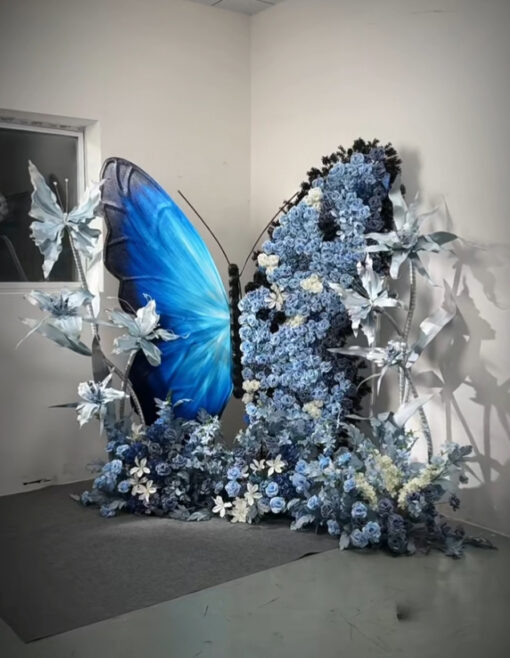 Chic Gradient Blue Butterfly Backdrop with Floral Accents for Gala Exhibitions