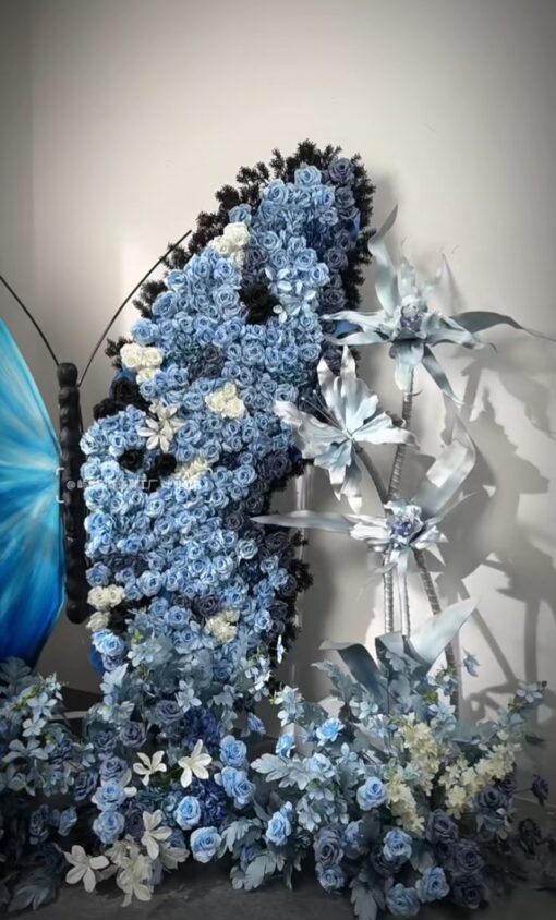 Chic Gradient Blue Butterfly Backdrop with Floral Accents for Gala Exhibitions