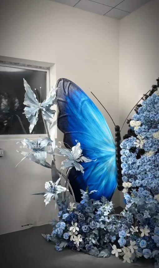 Chic Gradient Blue Butterfly Backdrop with Floral Accents for Gala Exhibitions