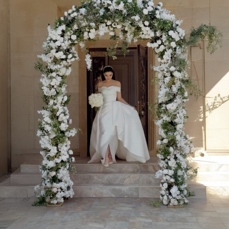 Classic Wedding Arch with White Roses and Greenery for a Perfect Wedding Backdrop