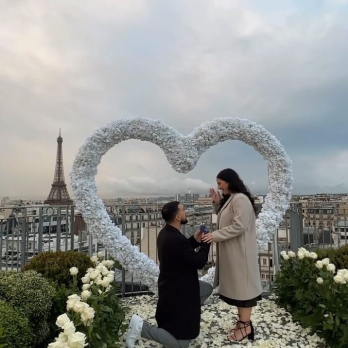 Create a Dreamy Proposal with a White Rose Heart-Shaped Arch Backdrop