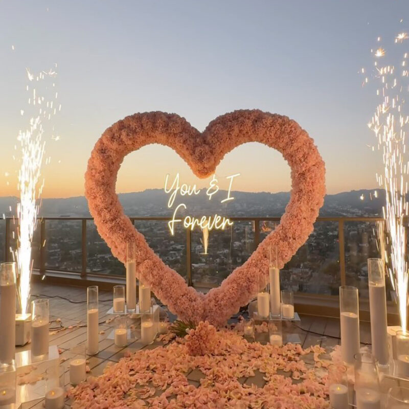 Create a Romantic Anniversary Moment with a Heart-Shaped Arch and Pink Roses