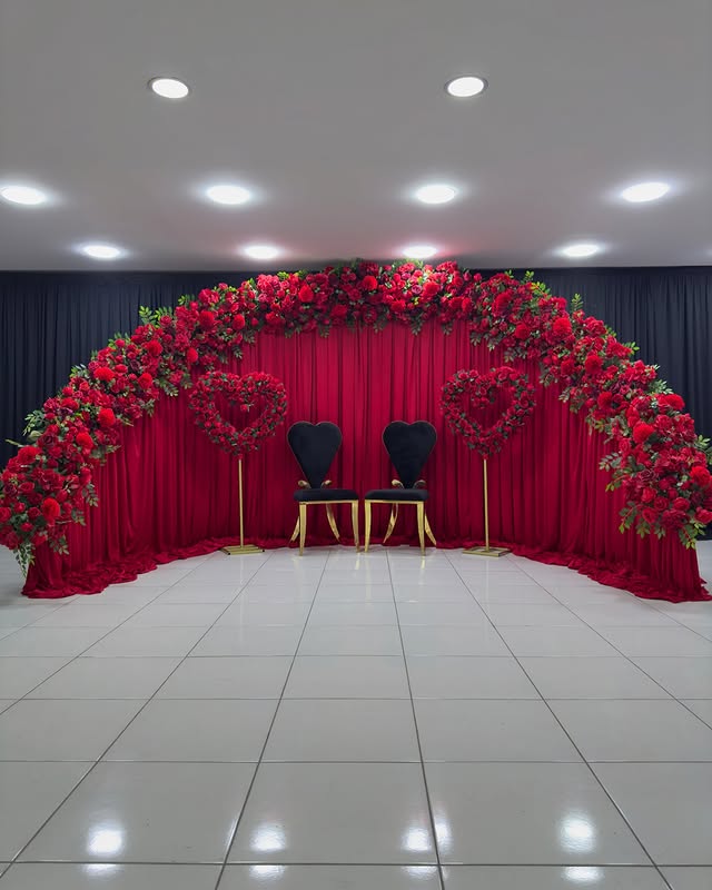 Create a Stunning Henna Party with a Red Rose Arch and Silk Curtain Backdrop