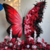 Dark and Vibrant Butterfly Backdrop with Pink and Black Contrast Flowers for Special Event Stage