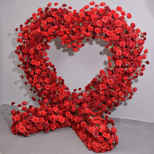 Dazzling Heart-Shaped Wedding Arch with Red Roses and Greenery for a Grand Wedding Backdrop