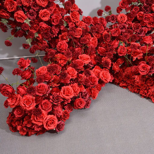Dazzling Heart-Shaped Wedding Arch with Red Roses and Greenery for a Grand Wedding Backdrop