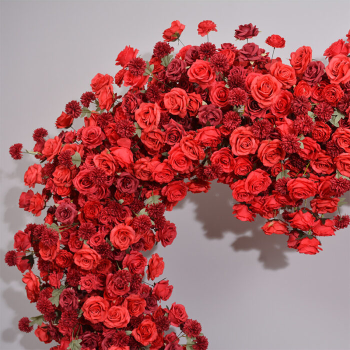 Dazzling Heart-Shaped Wedding Arch with Red Roses and Greenery for a Grand Wedding Backdrop