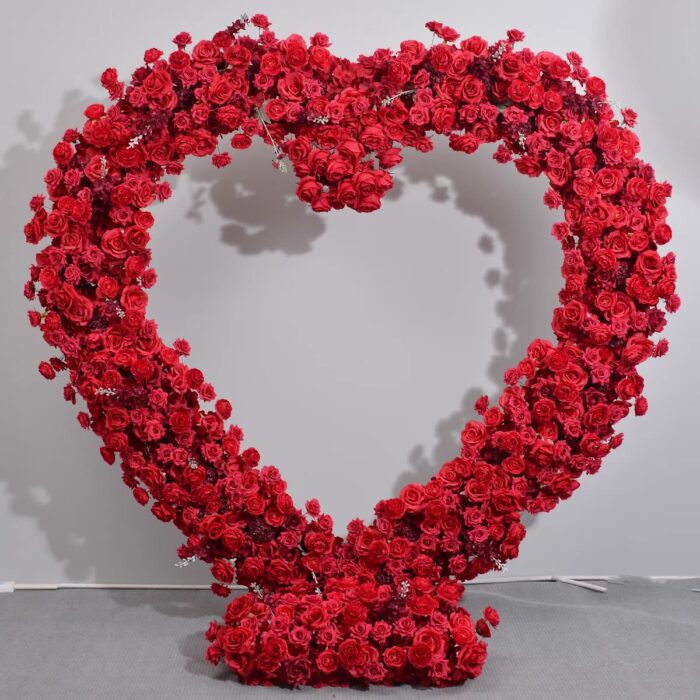 Dazzling Heart-Shaped Wedding Arch with Red Roses for a Grand Wedding Backdrop