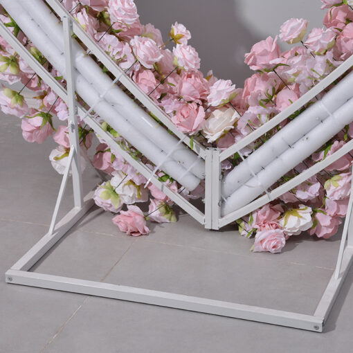 Delicate Heart-Shaped Arch with Soft Pink and Beige Roses for a Serene Wedding Atmosphere