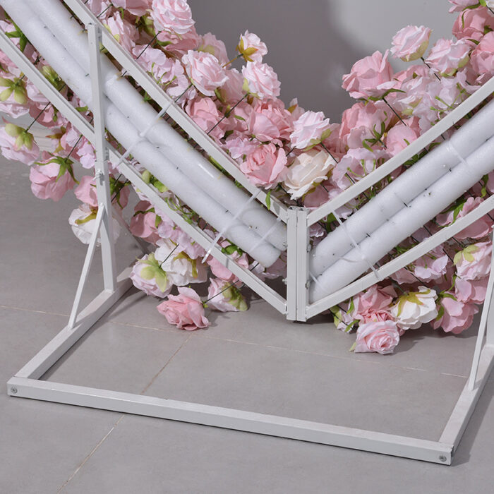 Delicate Heart-Shaped Arch with Soft Pink and Beige Roses for a Serene Wedding Atmosphere