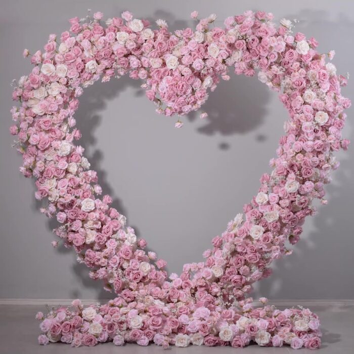 Delicate Heart-Shaped Arch with Soft Pink and Beige Roses for a Serene Wedding Atmosphere