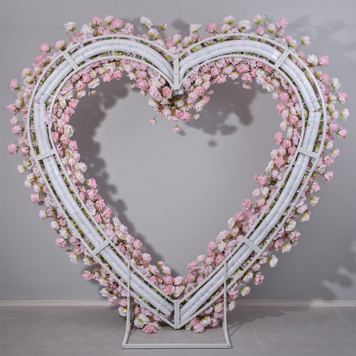 Delicate Heart-Shaped Arch with Soft Pink and Beige Roses for a Serene Wedding Atmosphere