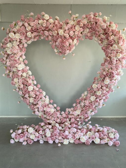 Delicate Heart-Shaped Arch with Soft Pink and Beige Roses for a Serene Wedding Atmosphere