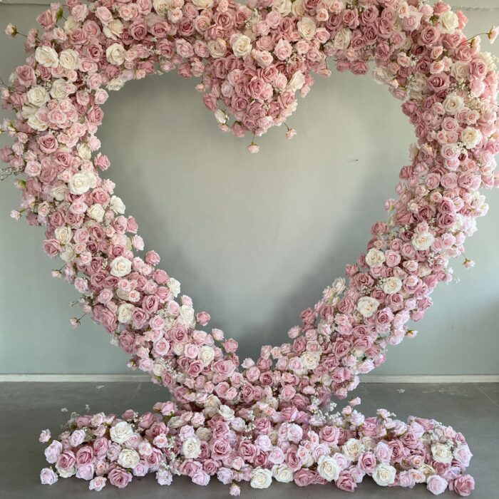 Delicate Heart-Shaped Arch with Soft Pink and Beige Roses for a Serene Wedding Atmosphere